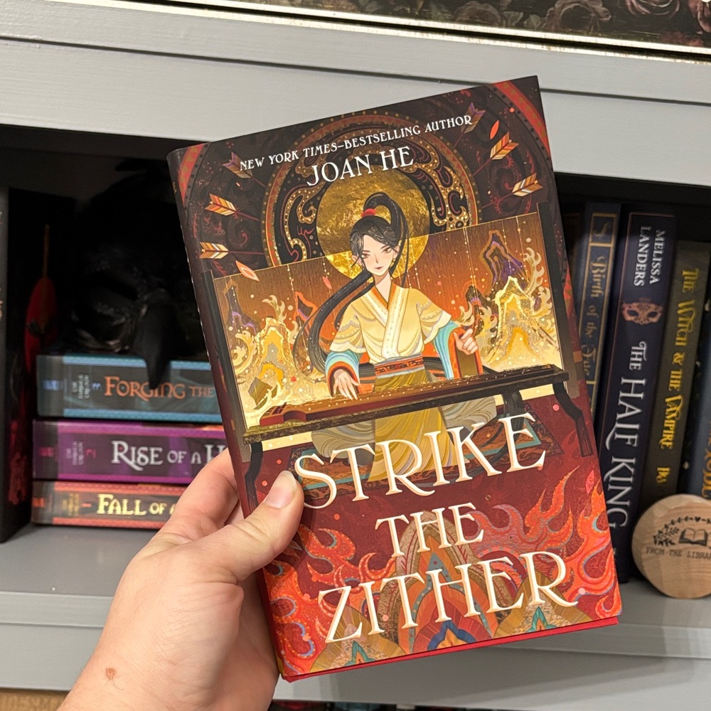 Strike the Zither Book by Joan He